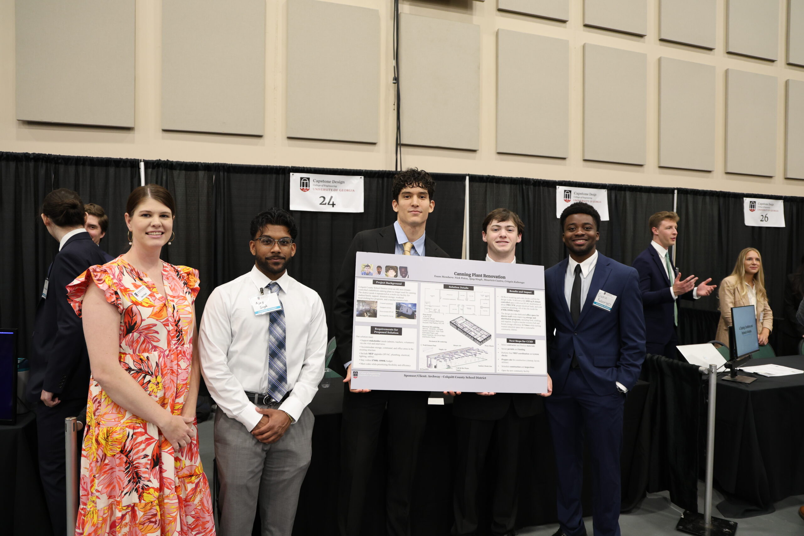 University of Georgia Engineering students stand with Archway Professional Sara Hand with a poster describing their work in Colquitt County
