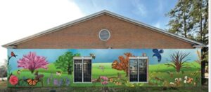 A mural design featuring wildlife and children's scenes